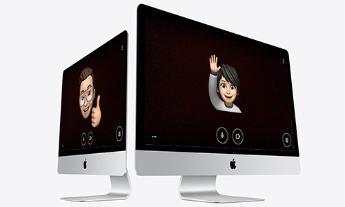 two computers showing two emojis communicating with each other